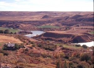 Springs gush from cliffs while melons litter the valley floor.